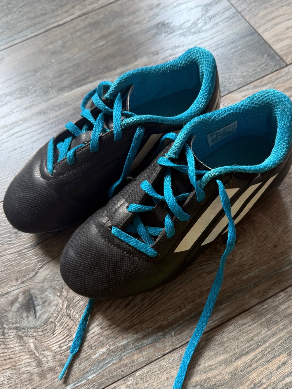Adidas kids black soccer cleats